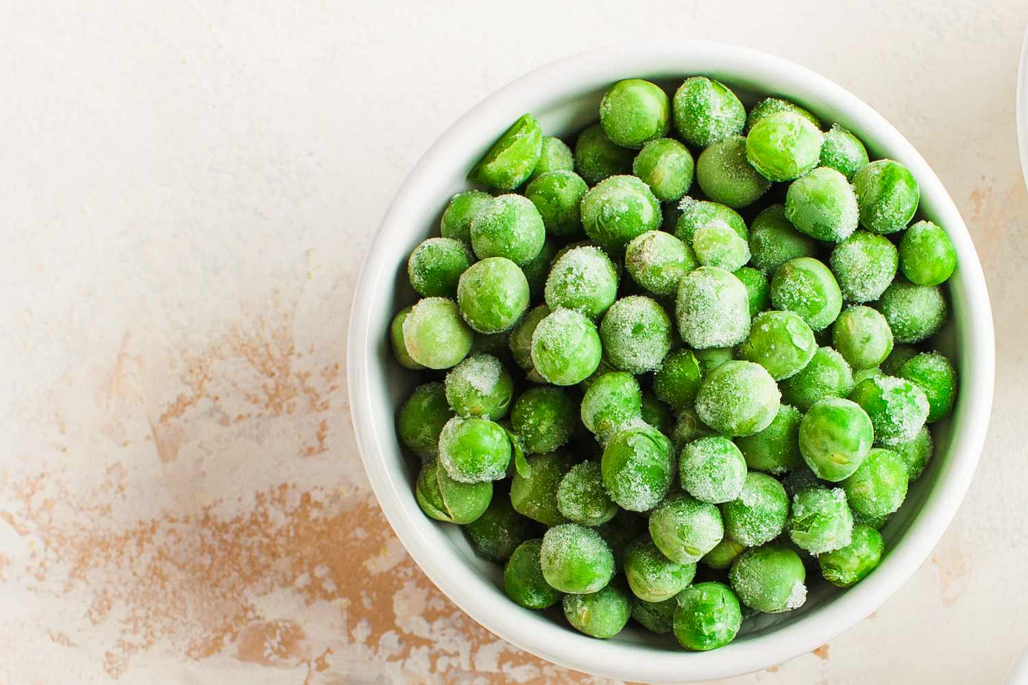 A bowl of frozen green peas