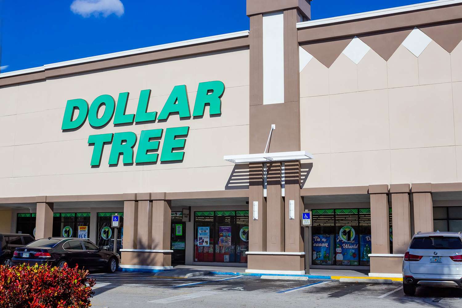 Exterior of a Dollar Tree store with parked cars in front