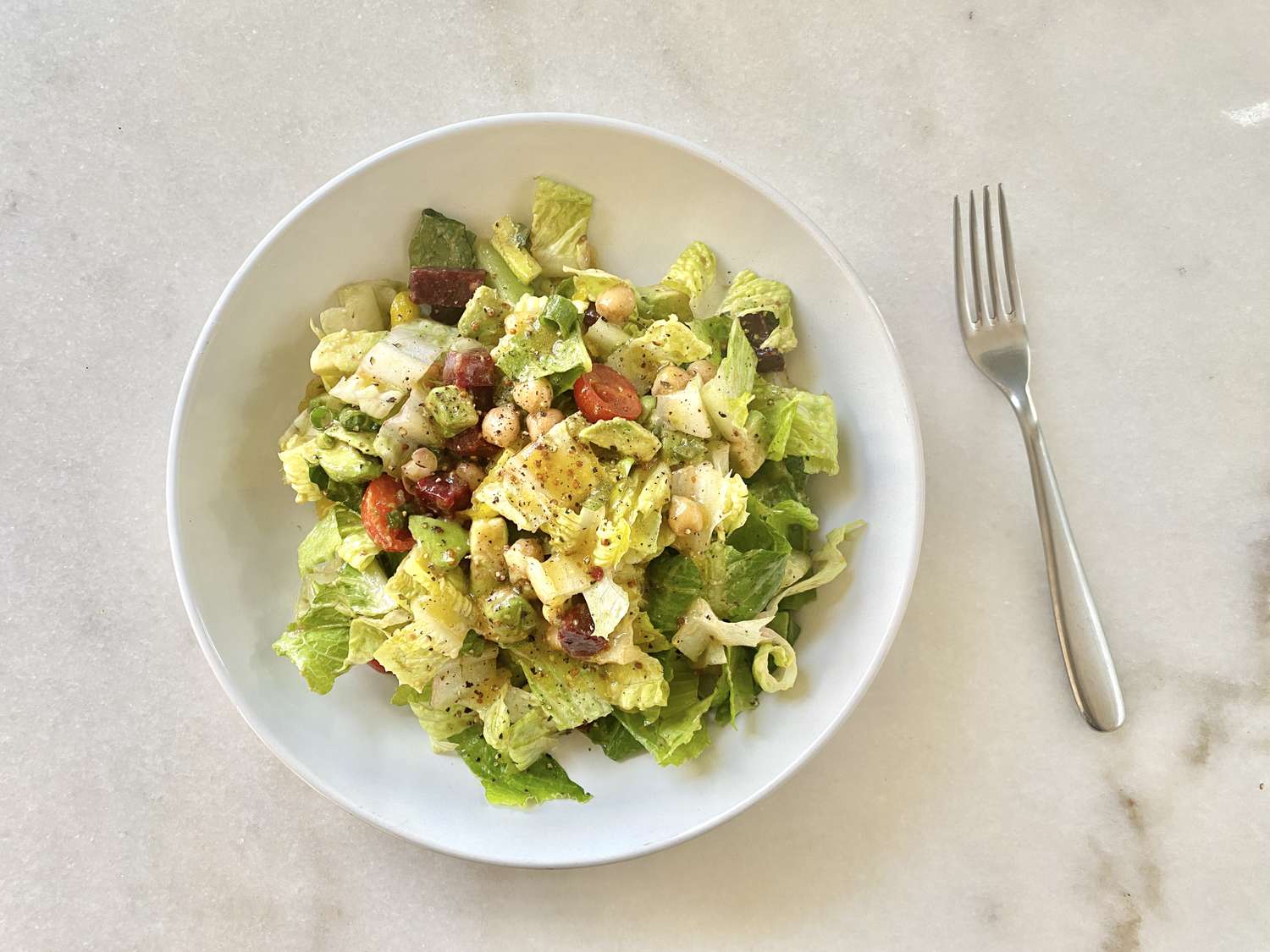 Gwyneth Paltrow's Really Good Chopped Salad in a bowl with a fork on the side