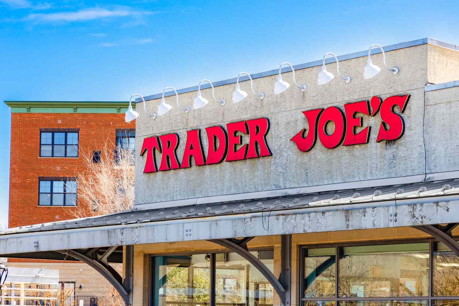 Trader Joe's storefront with red signage, exterior view.