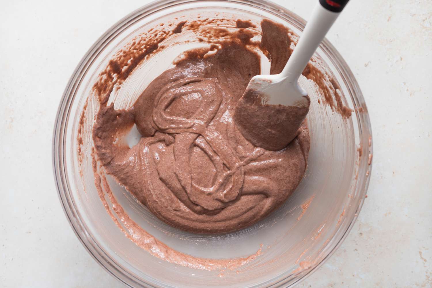 Doing the figure 8 test on batter for chocolate macarons.