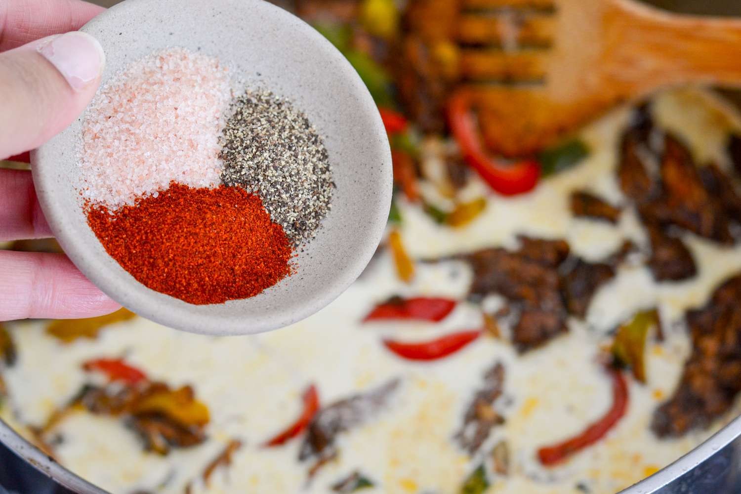 Seasoning Added to Jerk Chicken for Rasta Pasta