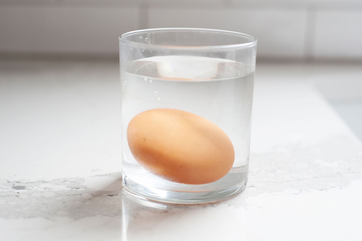 Egg in a glass of water.