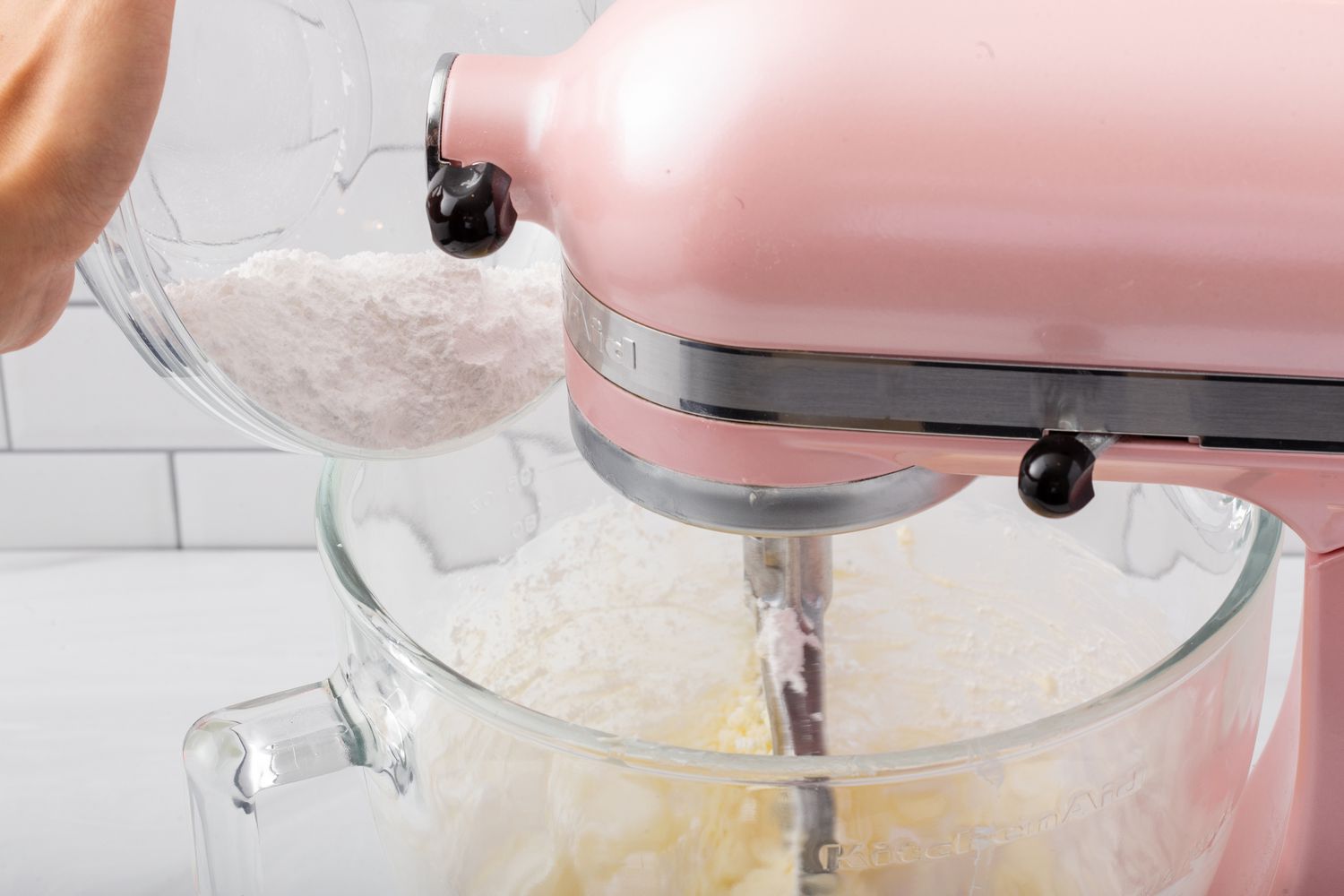 Making buttercream in a stand mixer for vanilla cupcakes.