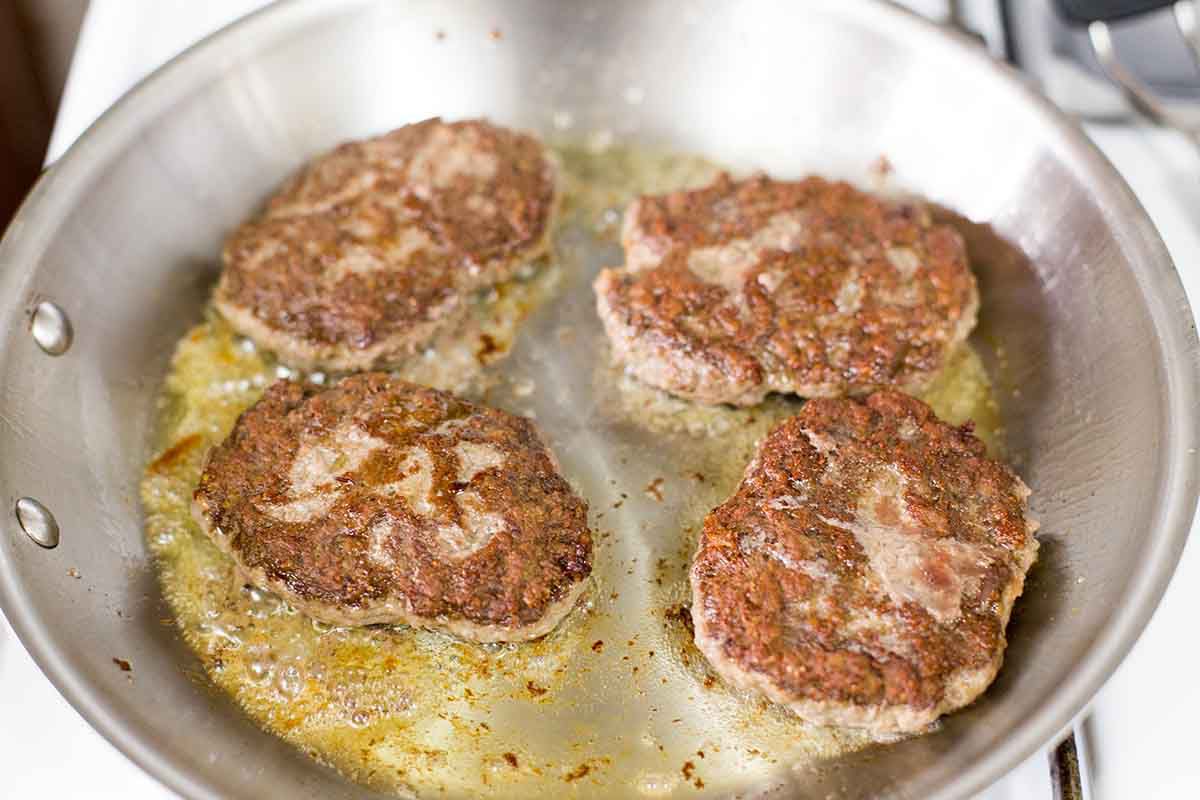 Sear the homemade salisbury steaks on both sides in a pan