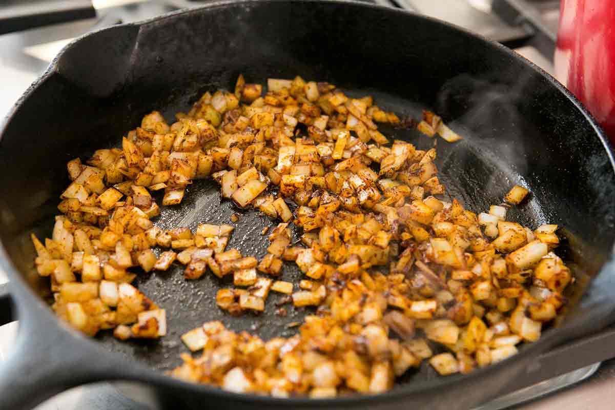 saute onions in spices for refried black beans add in