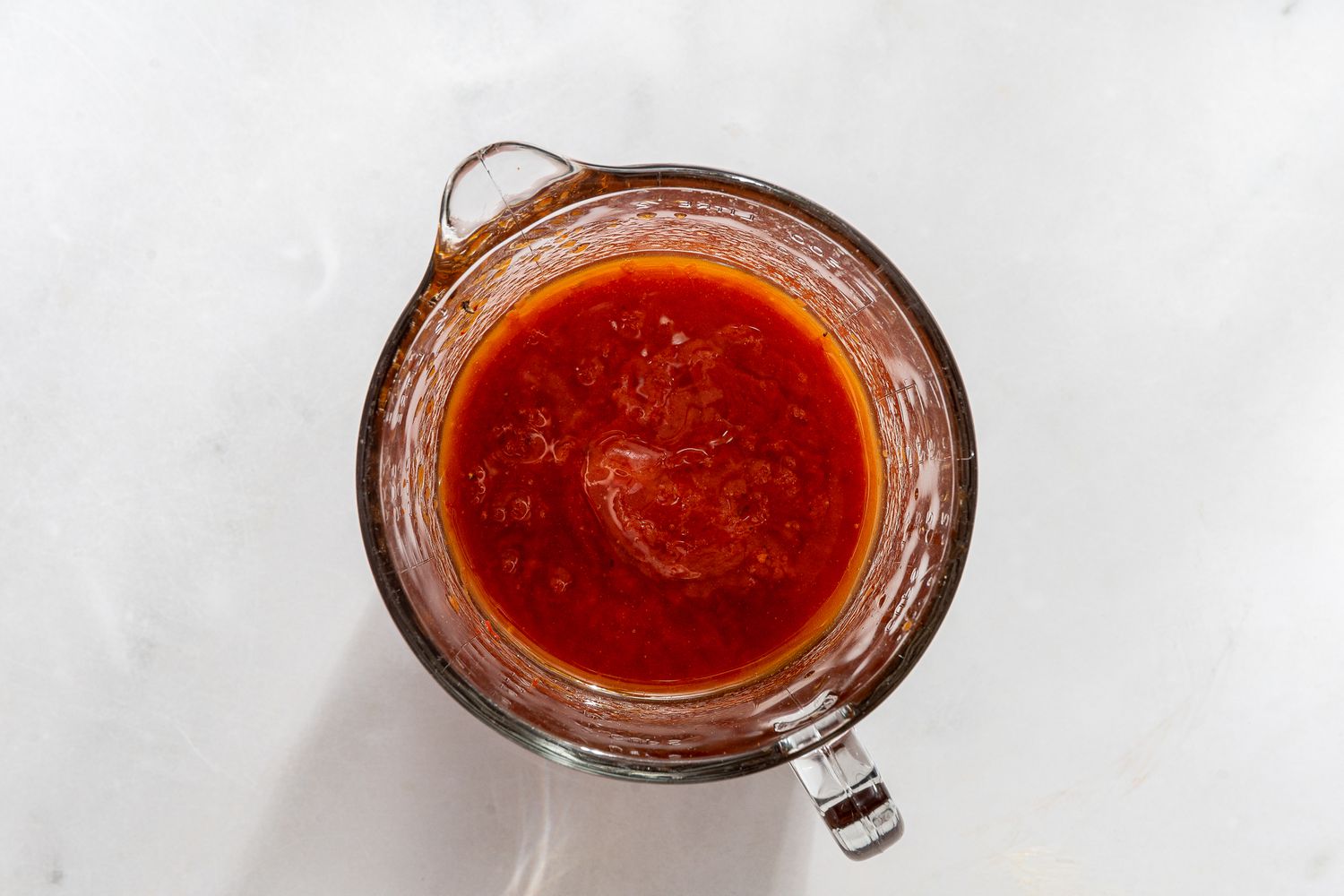 measuring cup with marinade for vegetables for caponata pasta recipe