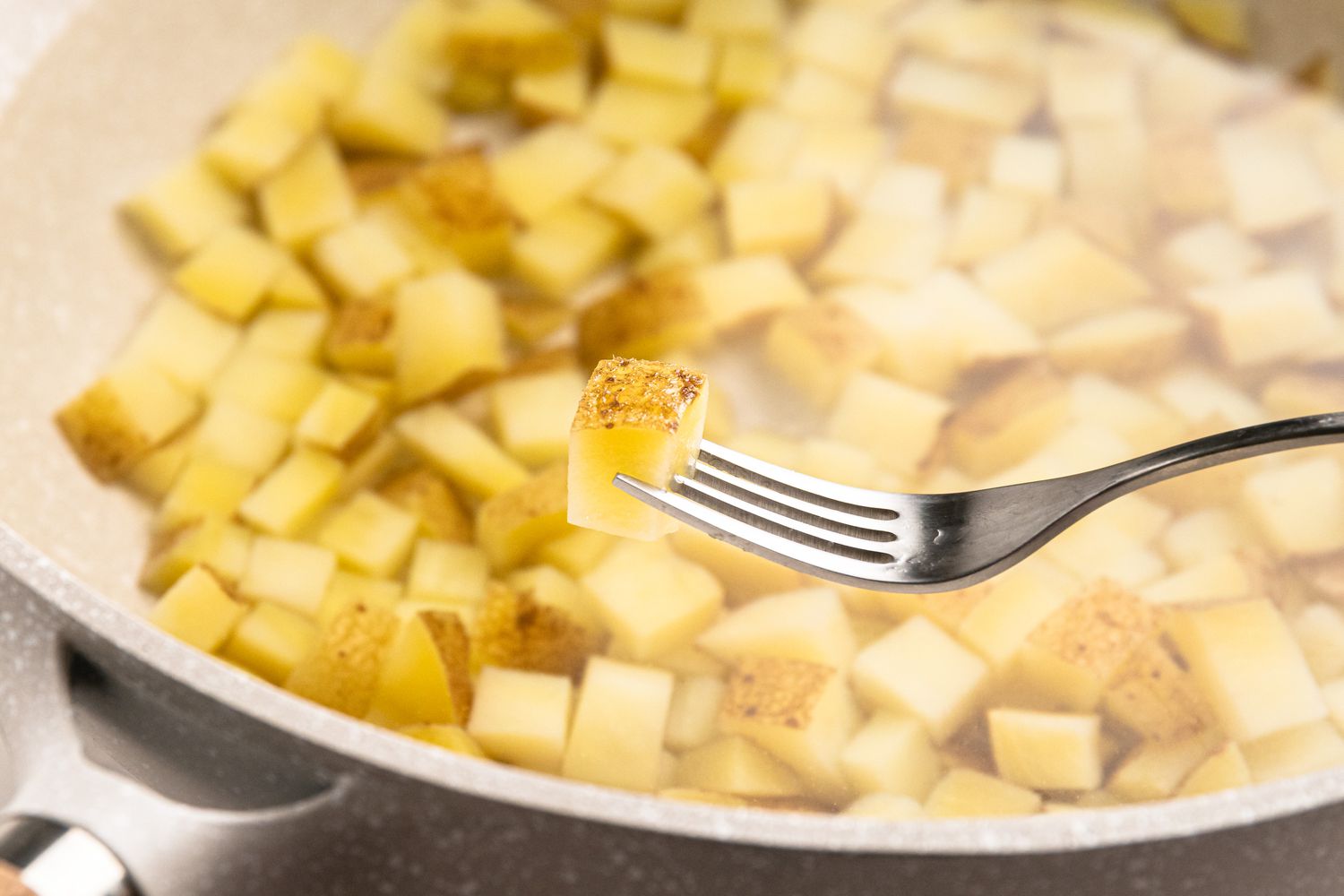 Boil potatoes until tender. 