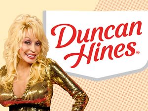 Dolly Parton smiling next to the Duncan Hines logo