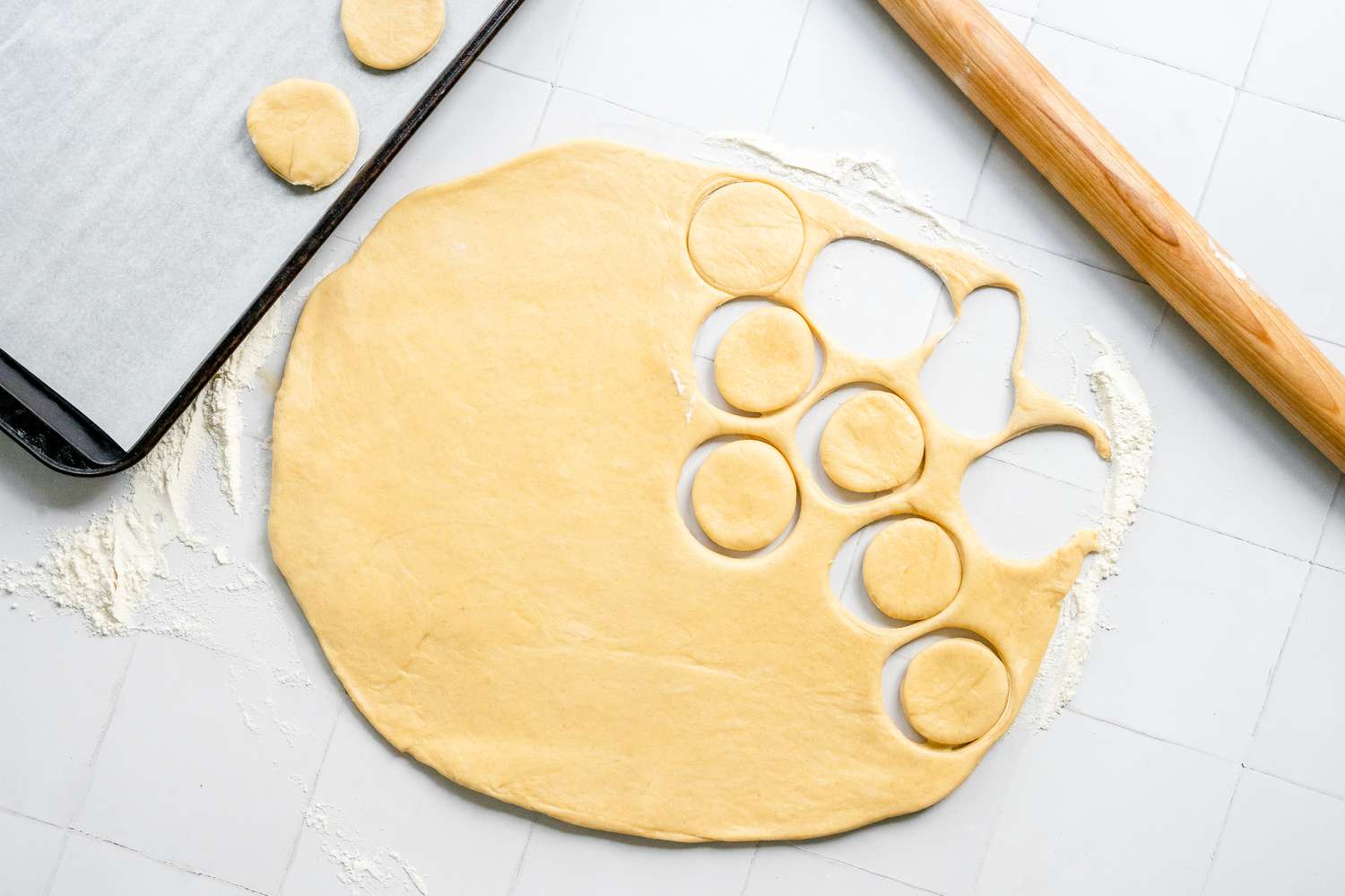 Israeli Jelly Donuts Dough Cut into Circular Pieces and Placed on Lined Baking Sheet