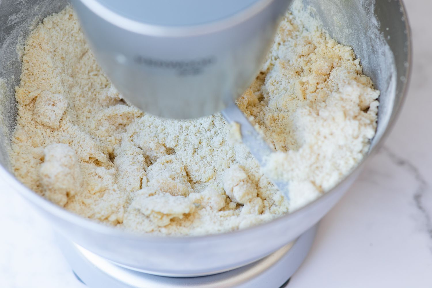 Making an almond cookie recipe in a stand mixer.