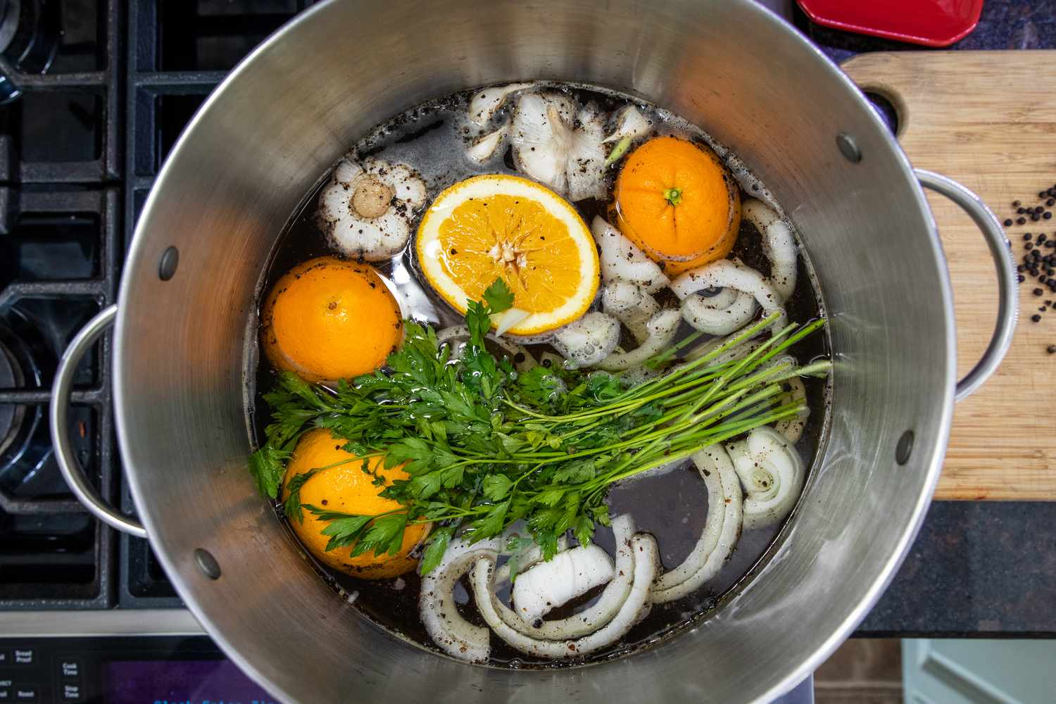 Overhead view of a pot filled with brining liquid for whole turkey