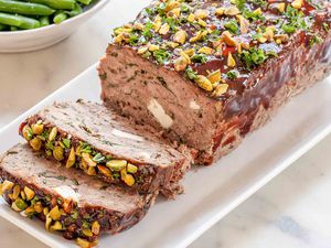 Greek style Meatloaf sliced on a white platter