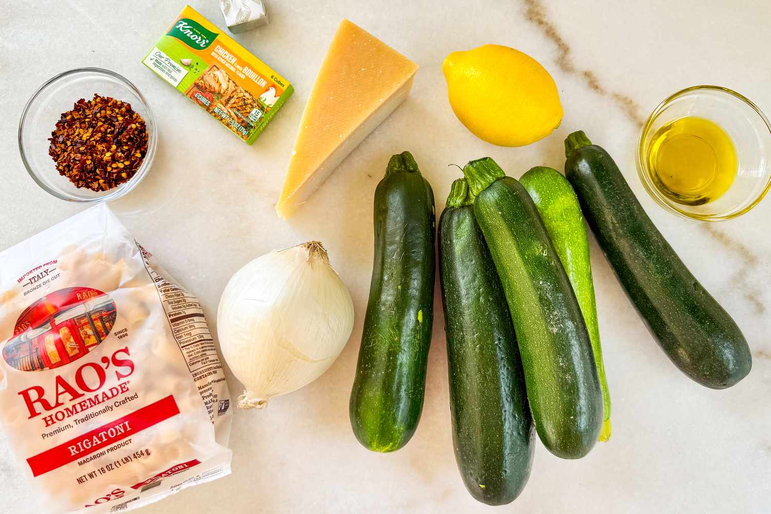 Overhead shot of the ingredients needed for Meghan Markle's pasta on a marble counter