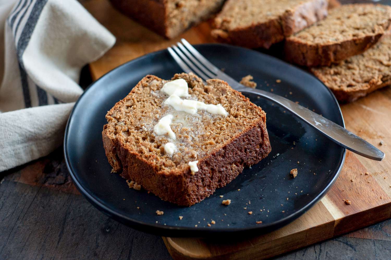 Slice of banana bread with butter. 