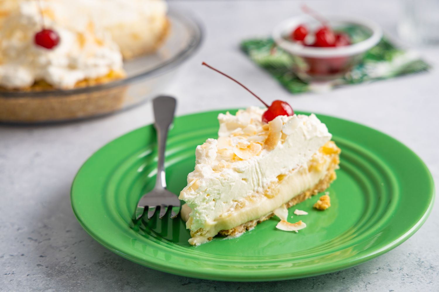 Slice of Piña Colada Pie on a Plate with Some on a Fork