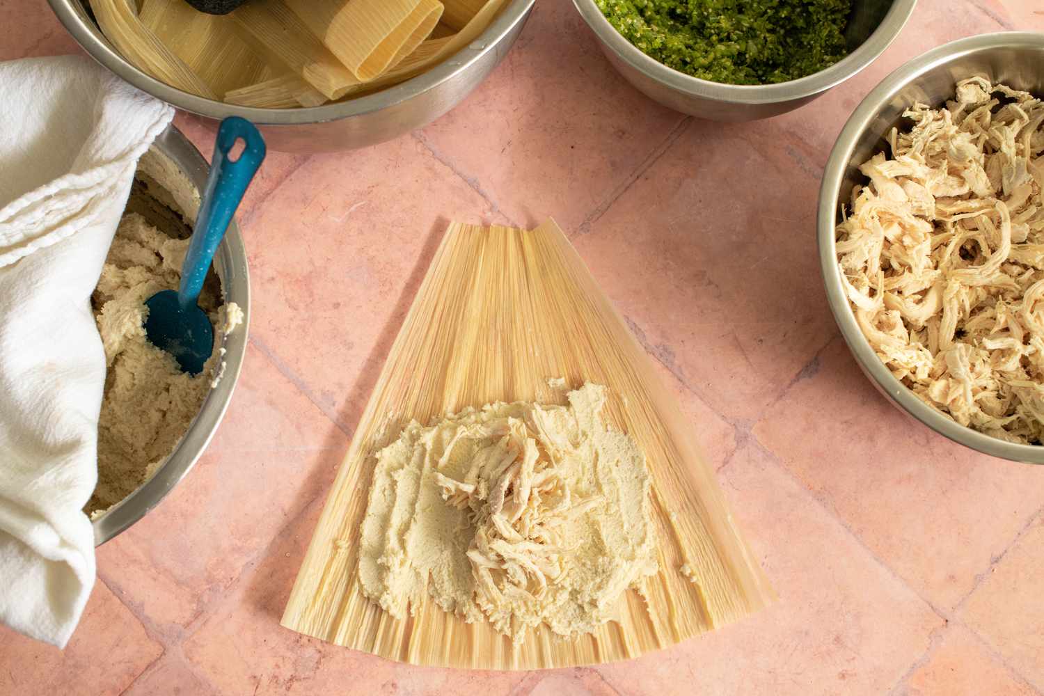 Making the Tamales: Shredded Chicken Added on Top of Masa
