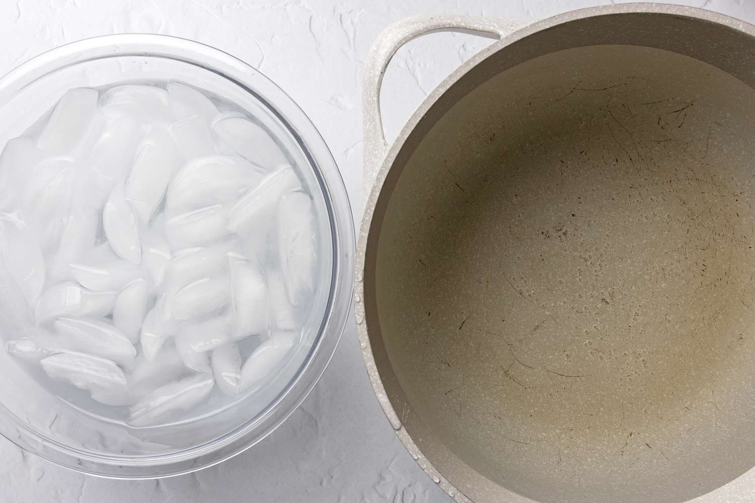 Bowl of Ice Water and a Pot of Boiling Water Situated Next to Each Other for Slow Cooker Green Bean Casserole