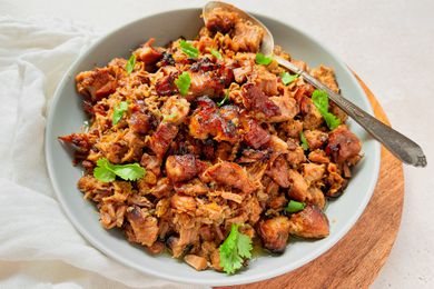 Carnitas in a Bowl with a Serving Spoon