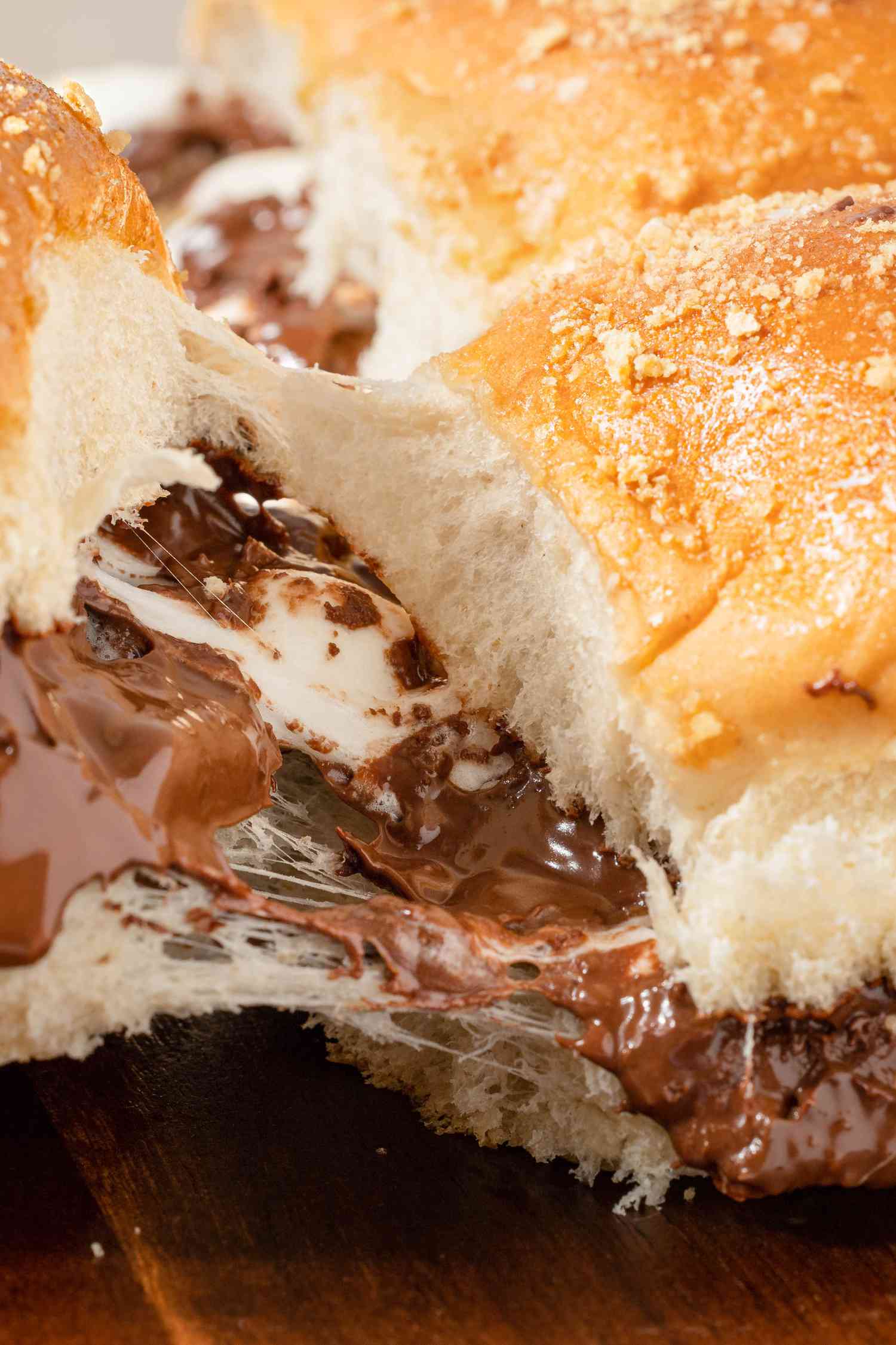 Close-up: One S'mores Slider Pulled From Another, Resulting in an Ooey-Gooey Chocolate & Marshmallow Pull