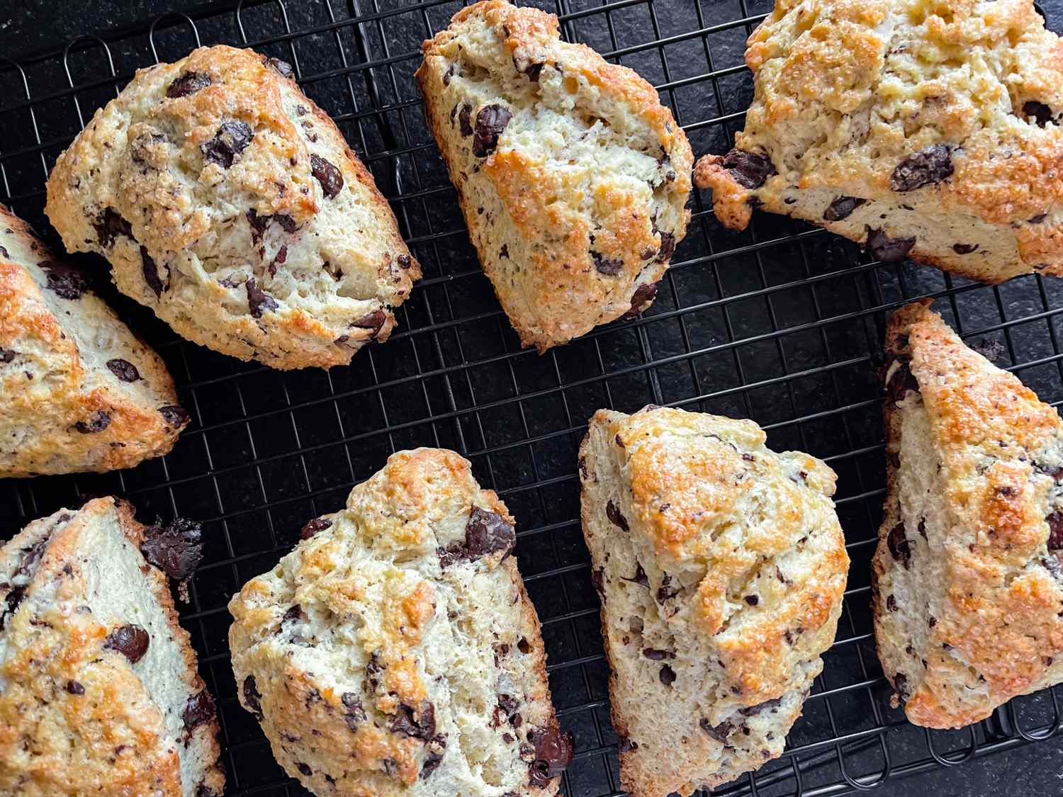 Baked scones with chocolate chips on a cooling rack