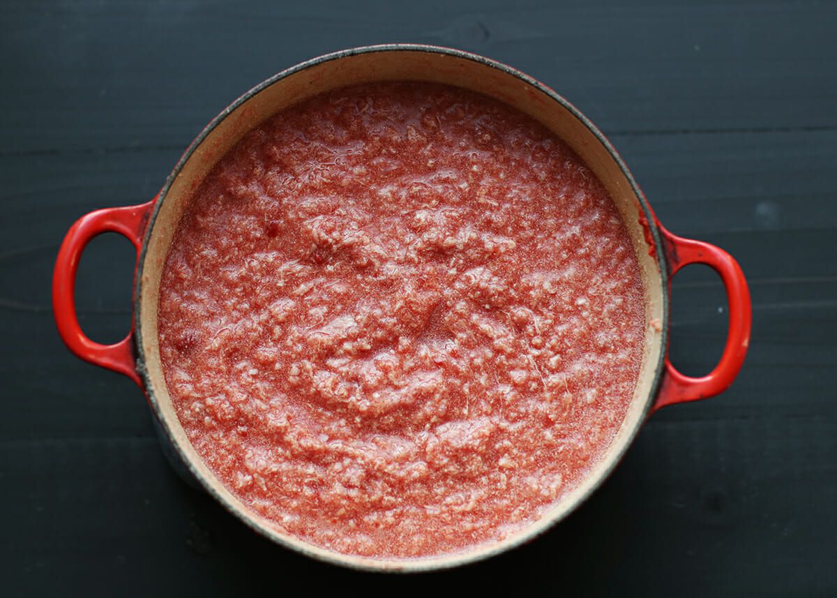 How to Make Cincinnati Chili simmer the beef and tomatoes