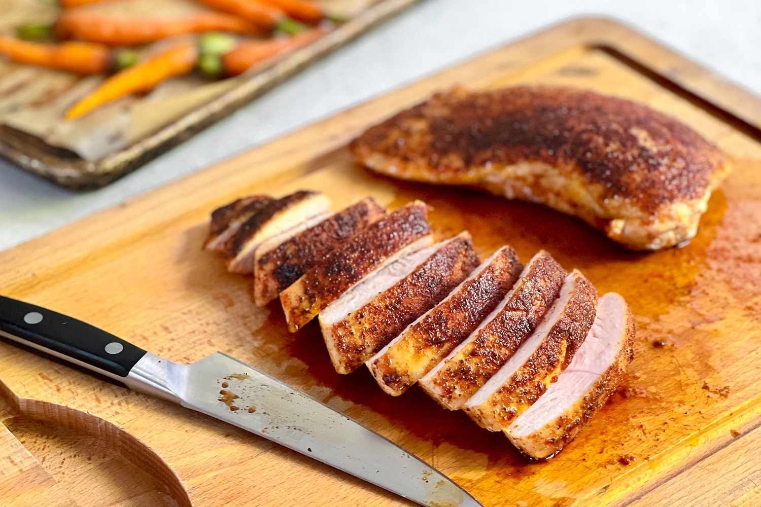 Turkey Tenderloin Sliced on a Cutting Board