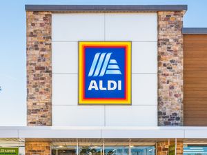 The exterior of an Aldi store with the Aldi logo prominently displayed