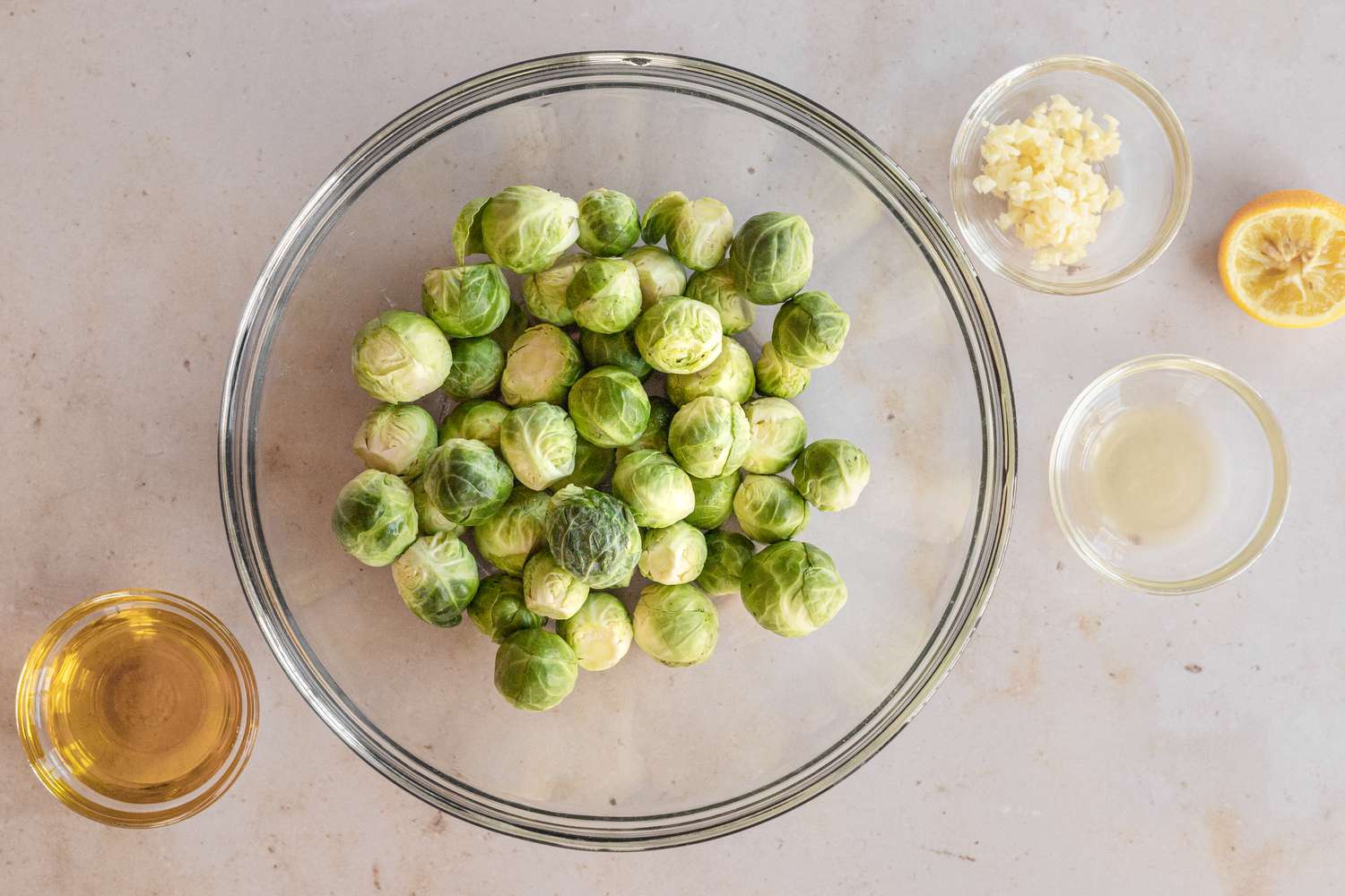 Making the best brussel sprouts recipe in a glass dish.