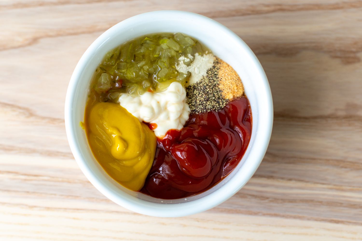 Bowl With Relish, Mayonnaise, Mustard, Ketchup, and Seasonings for Burger Salad Dressing
