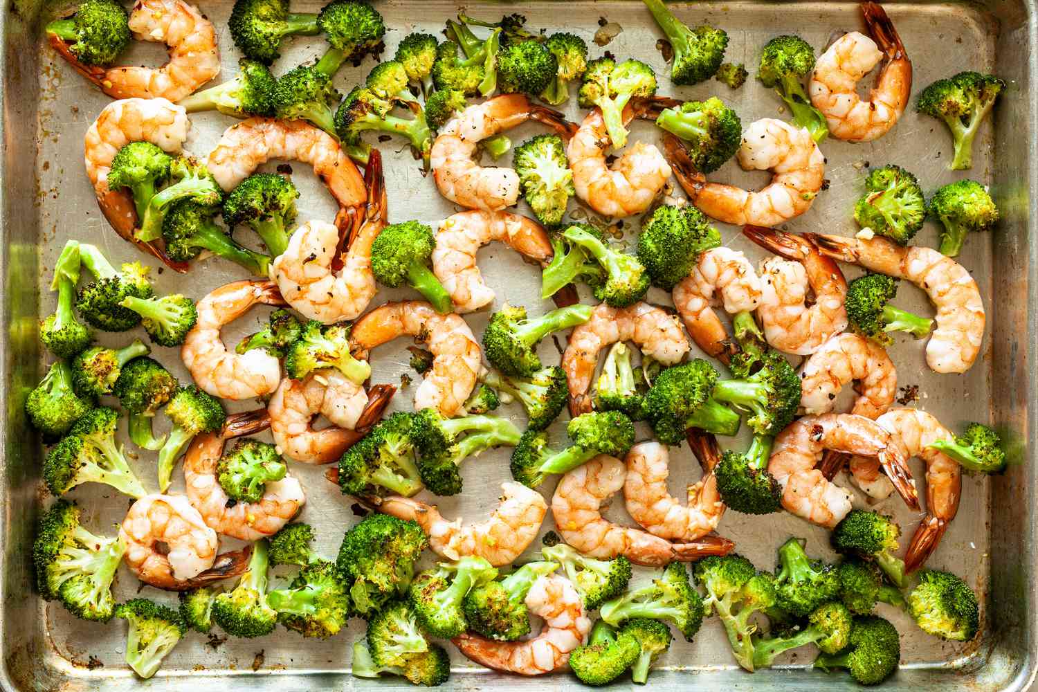 Broccoli and shrimp on a sheet pan to make Easy Sheet Pan Shrimp and Broccoli.