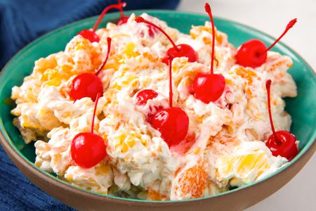 Rosa marina salad garnished with cherries in a bowl