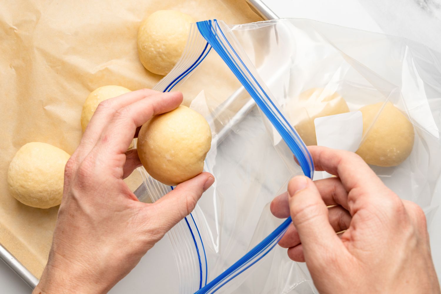 zip-top bag being filled with dough balls