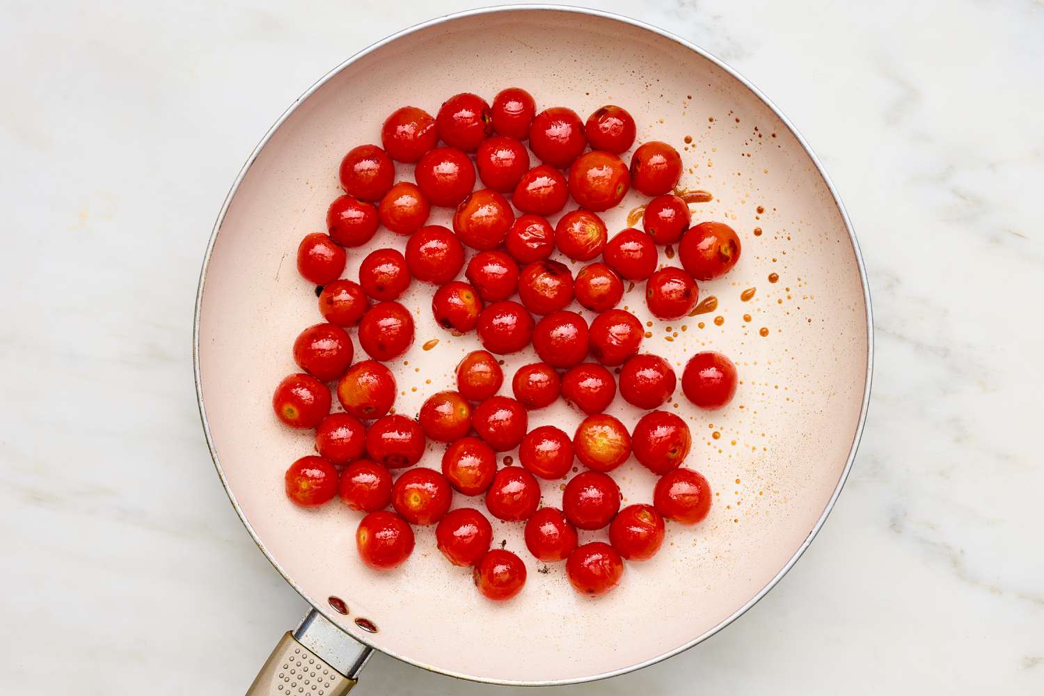 Tomatoes roasted on a skillet for Creamy Skillet Shrimp with Corn, Pancetta, and Tomatoes recipe