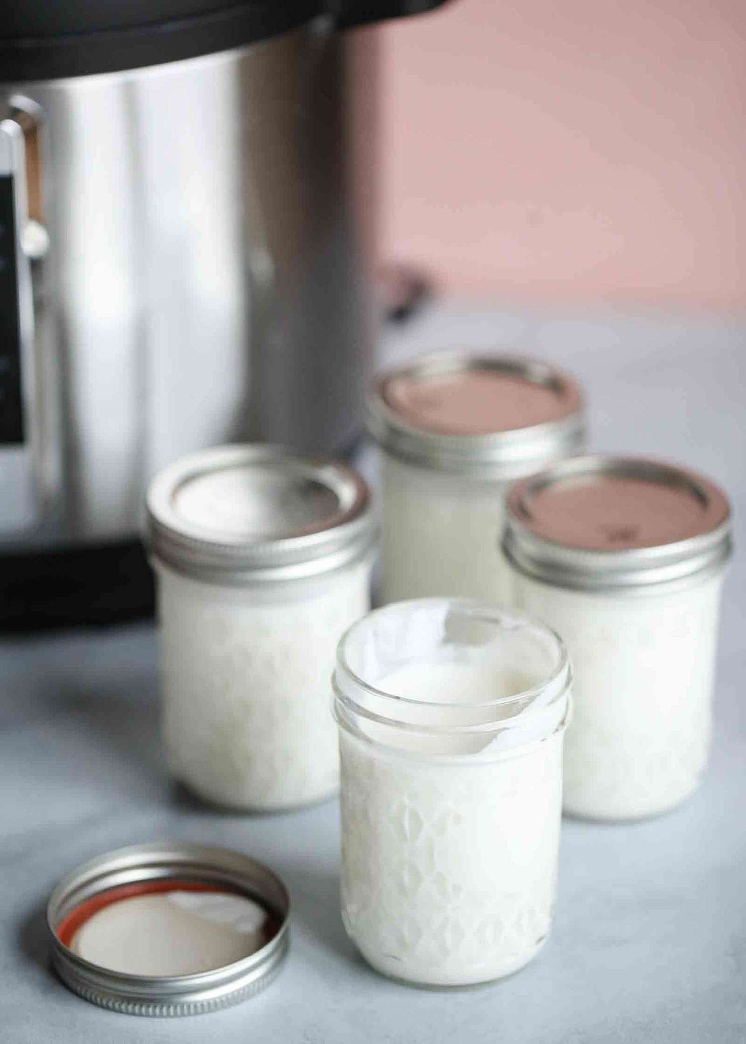 Homemade Yogurt resting in four jars