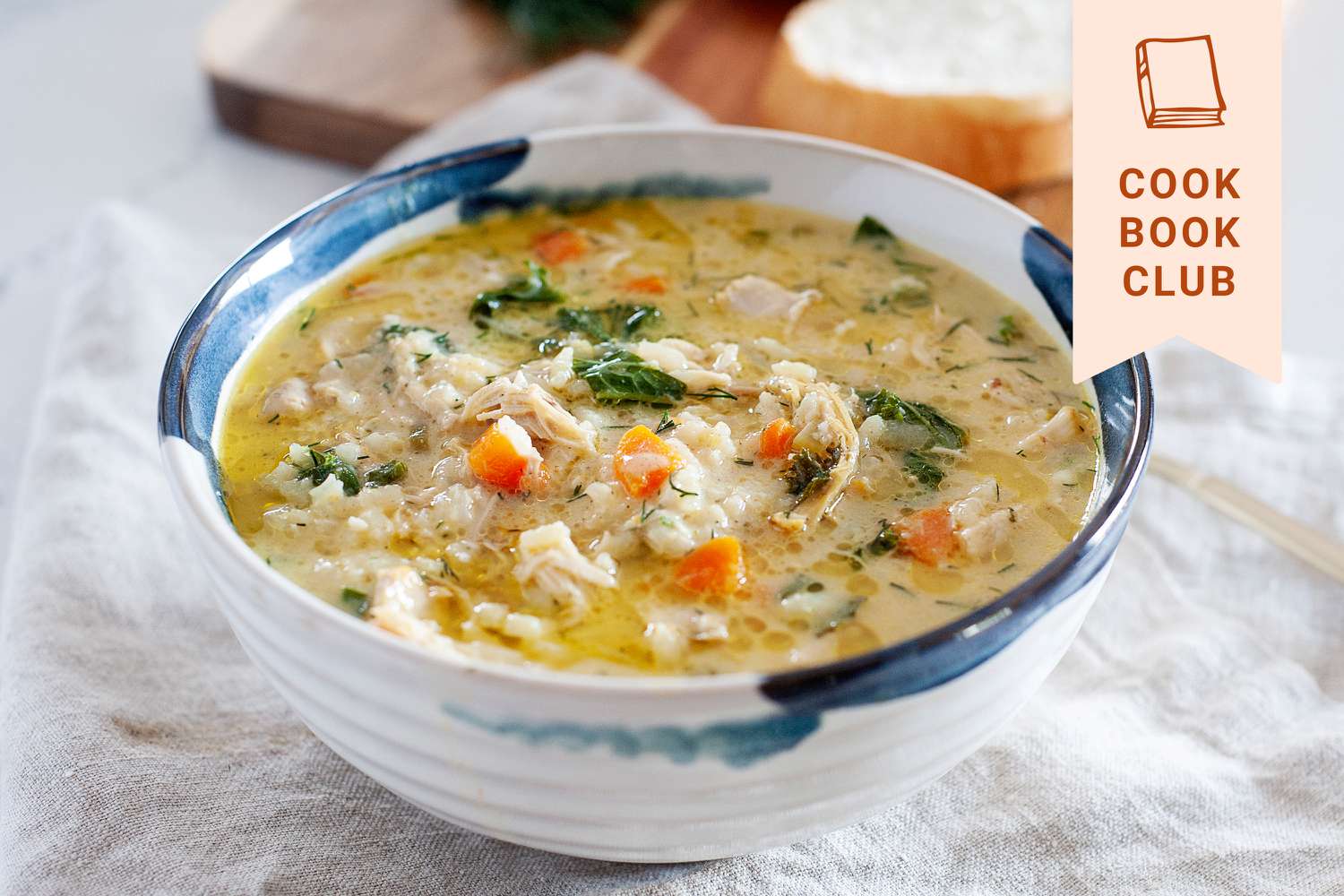Yasmin Khan’s Lemon Chicken Soup in a bowl with a white linen underneath it.