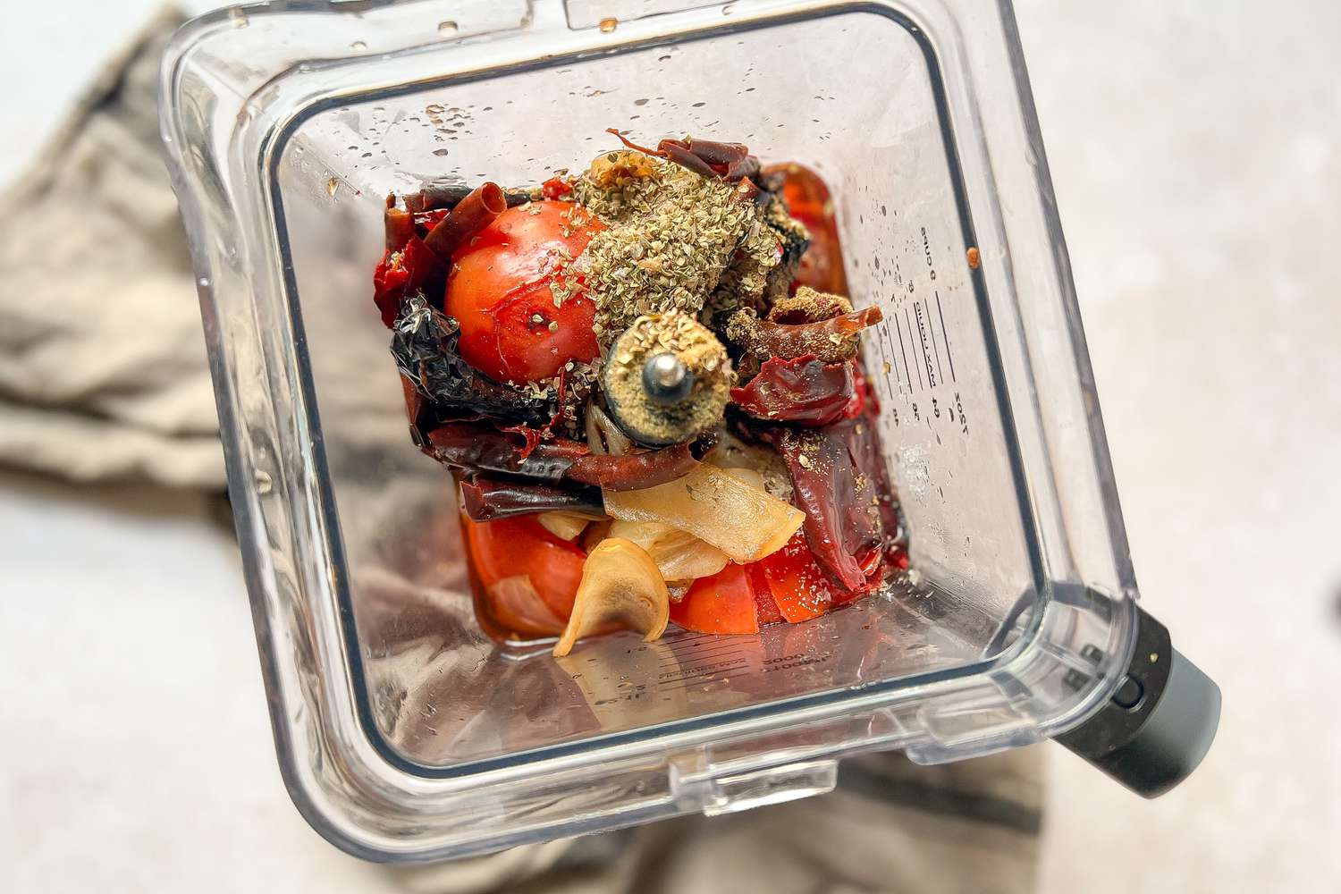 Blend Peppers, Tomatoes, and Onions in a blender 