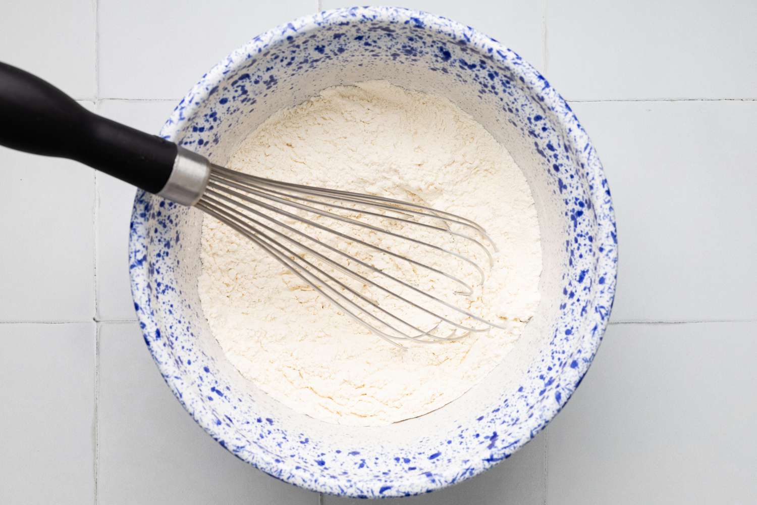 Bowl of Dry Ingredients Whisked Together for Banana Chocolate Chip Muffins