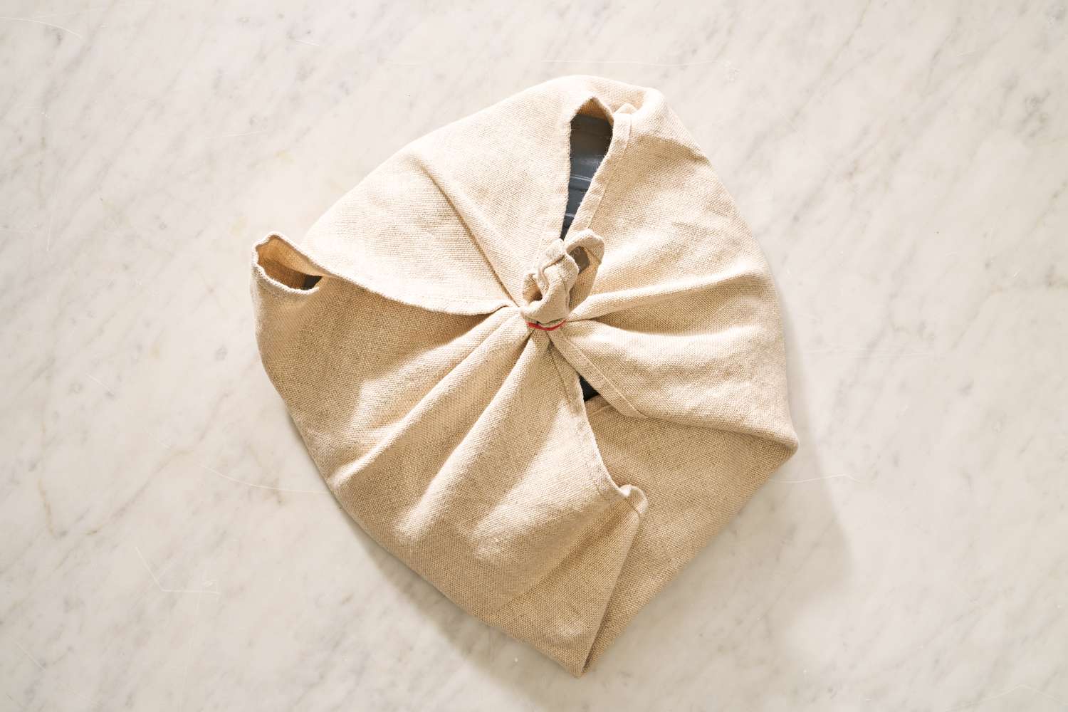 braiser lid wrapped with a kitchen towel for blueberry grunt recipe