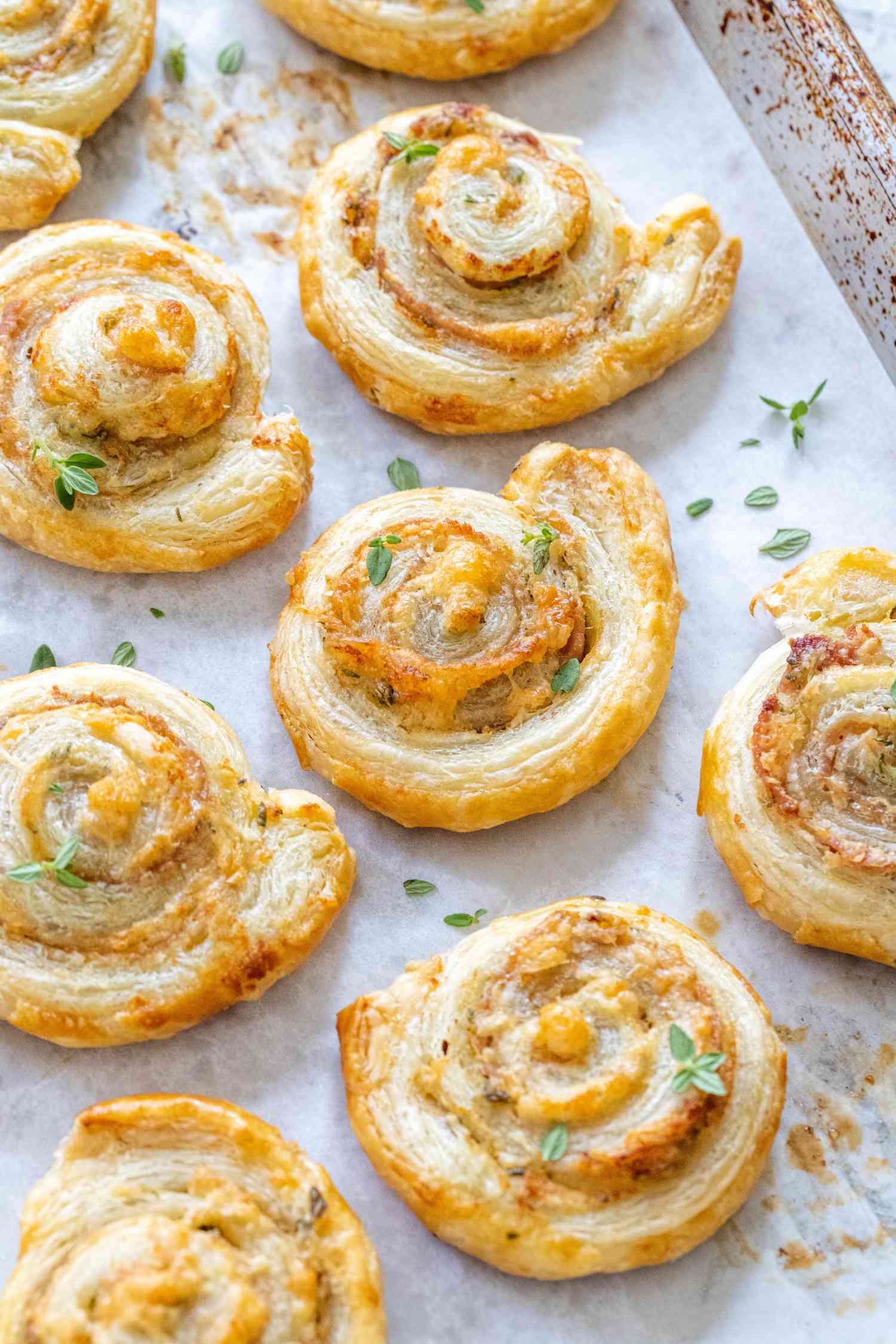 Savory pinwheels on a white platter.