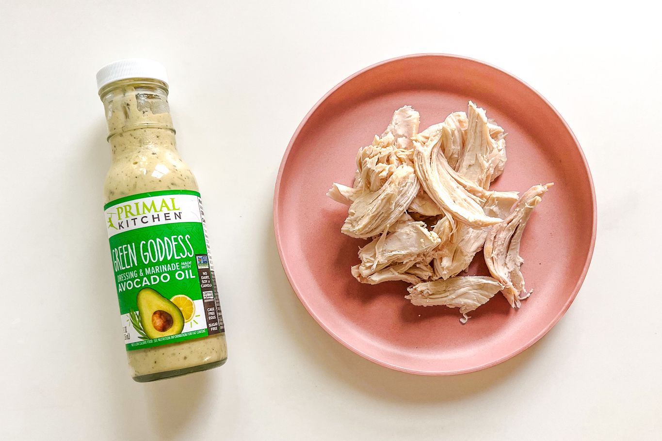 shredded chicken and a bottle of green goddess dressing on the counter