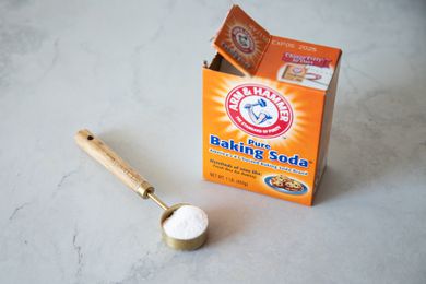 Box of Baking Soda and a Measuring Spoon Full of Baking Soda