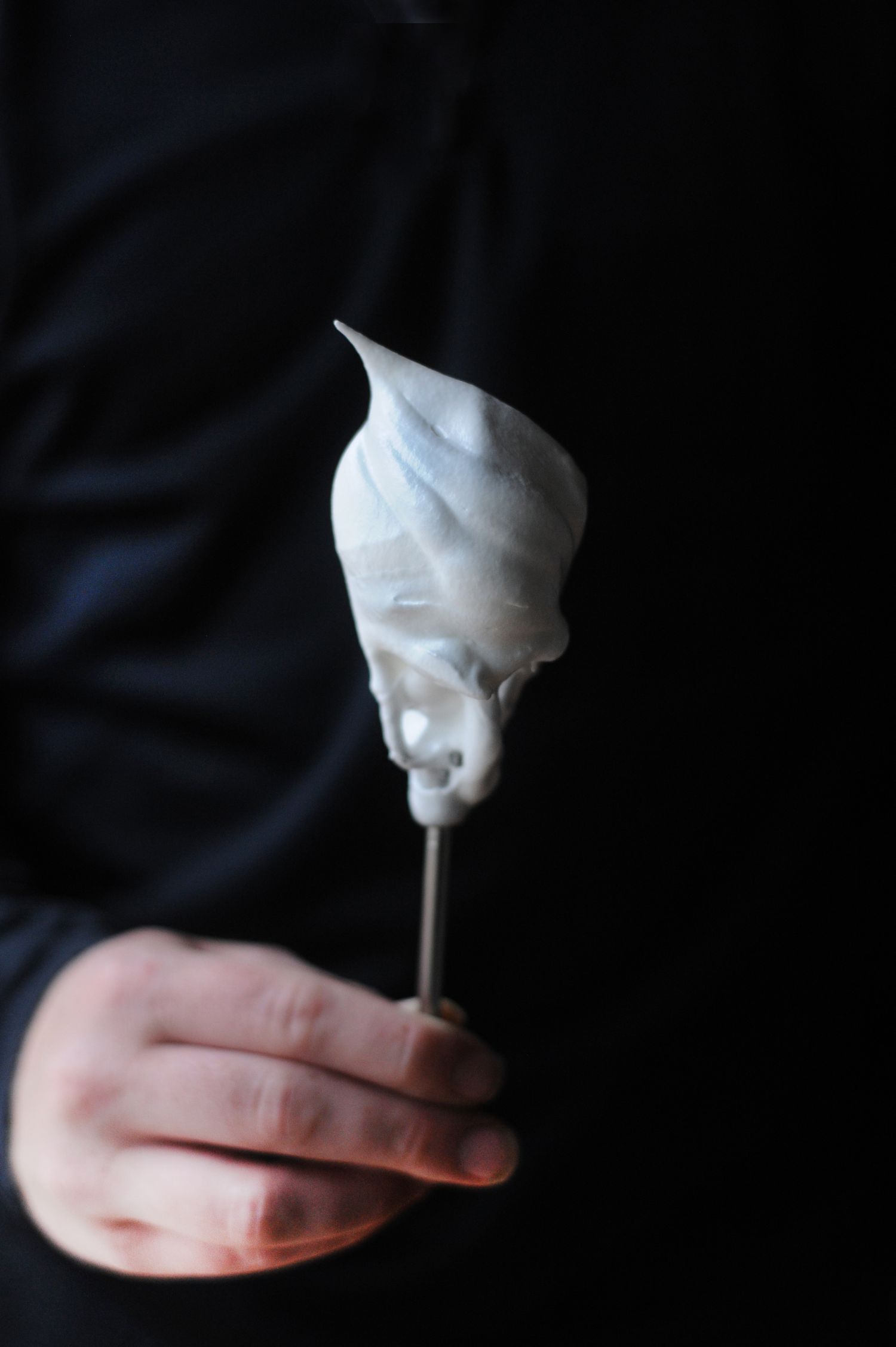 Easy Marshmallow Meringue Frosting on a spoon.