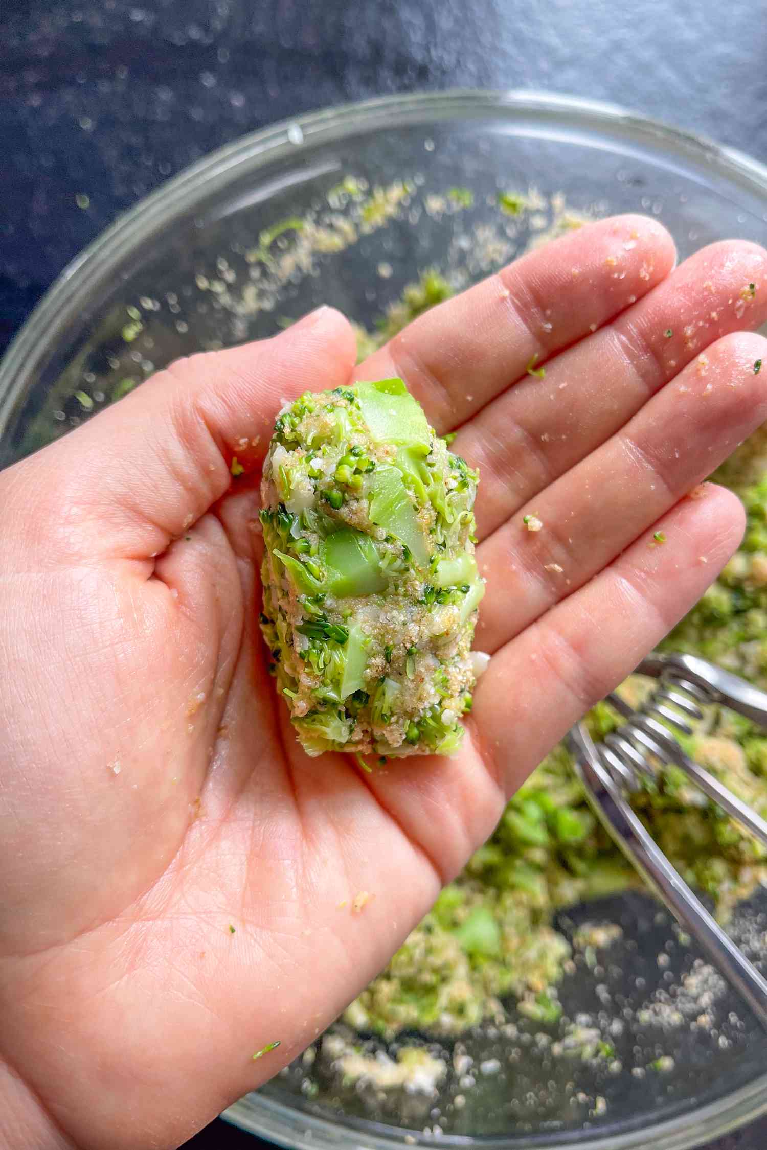 hand forming the tots