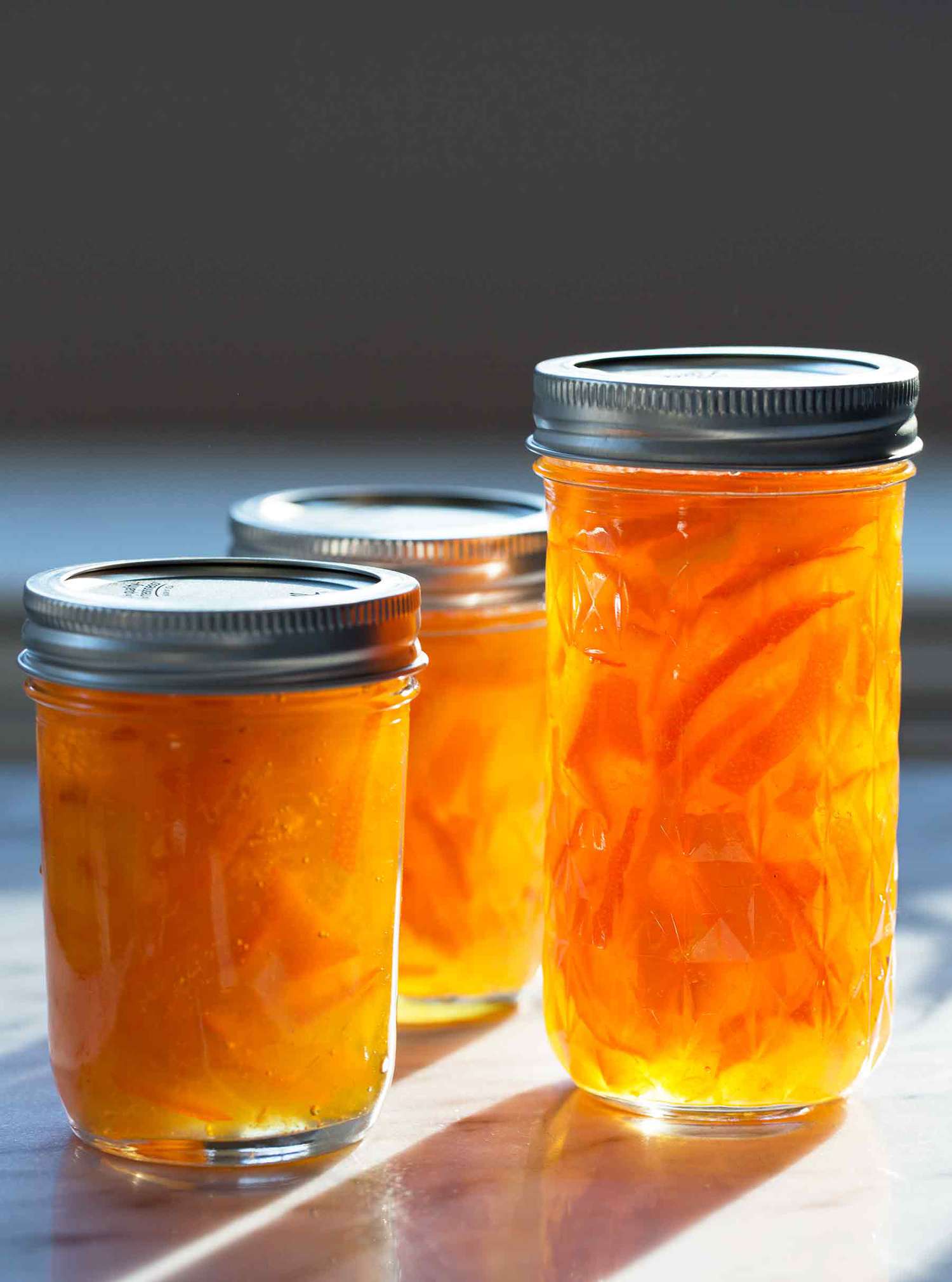 Jars of Seville orange marmalade in the sunlight