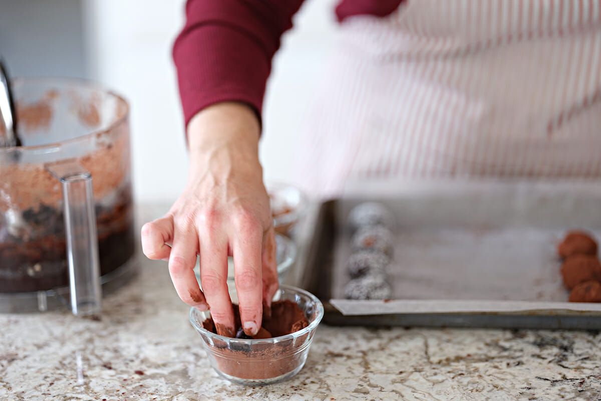No-Bake Date Balls roll the balls in cocoa powder