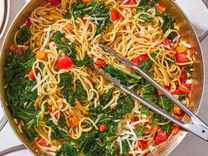One-Pot Spaghetti with Kale in a pot with tongs