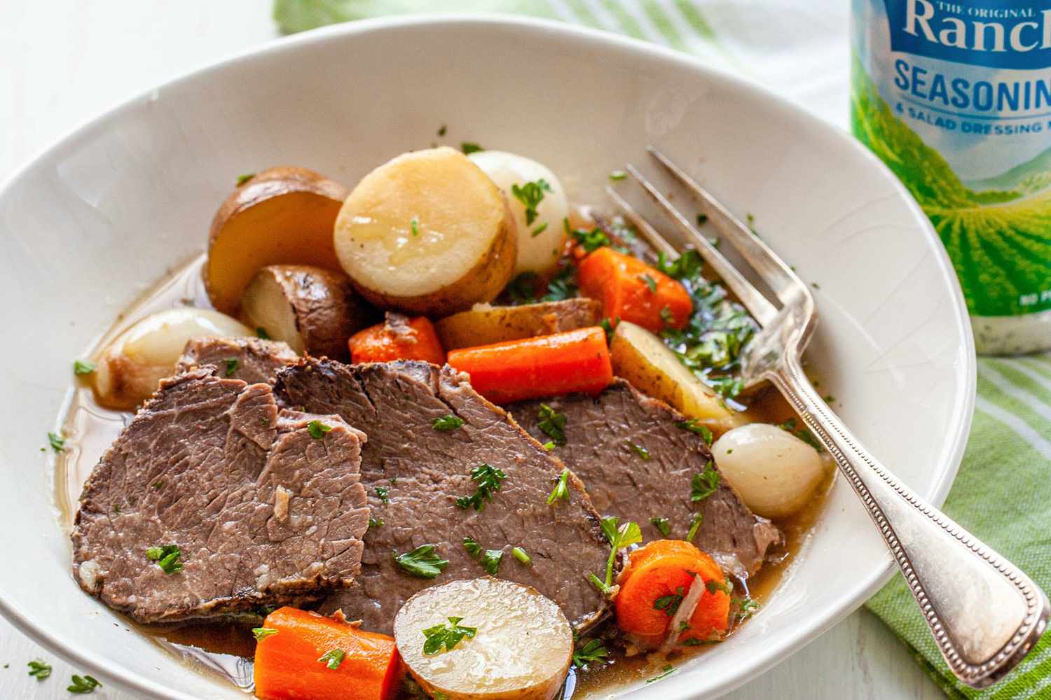 A plate of pot roast, ready to serve