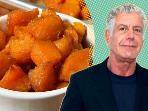 Anthony Bourdain next to a bowl of cooked sweet potatoes