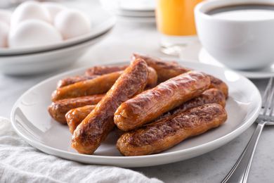 SIde view of a plate with breakfast sausages